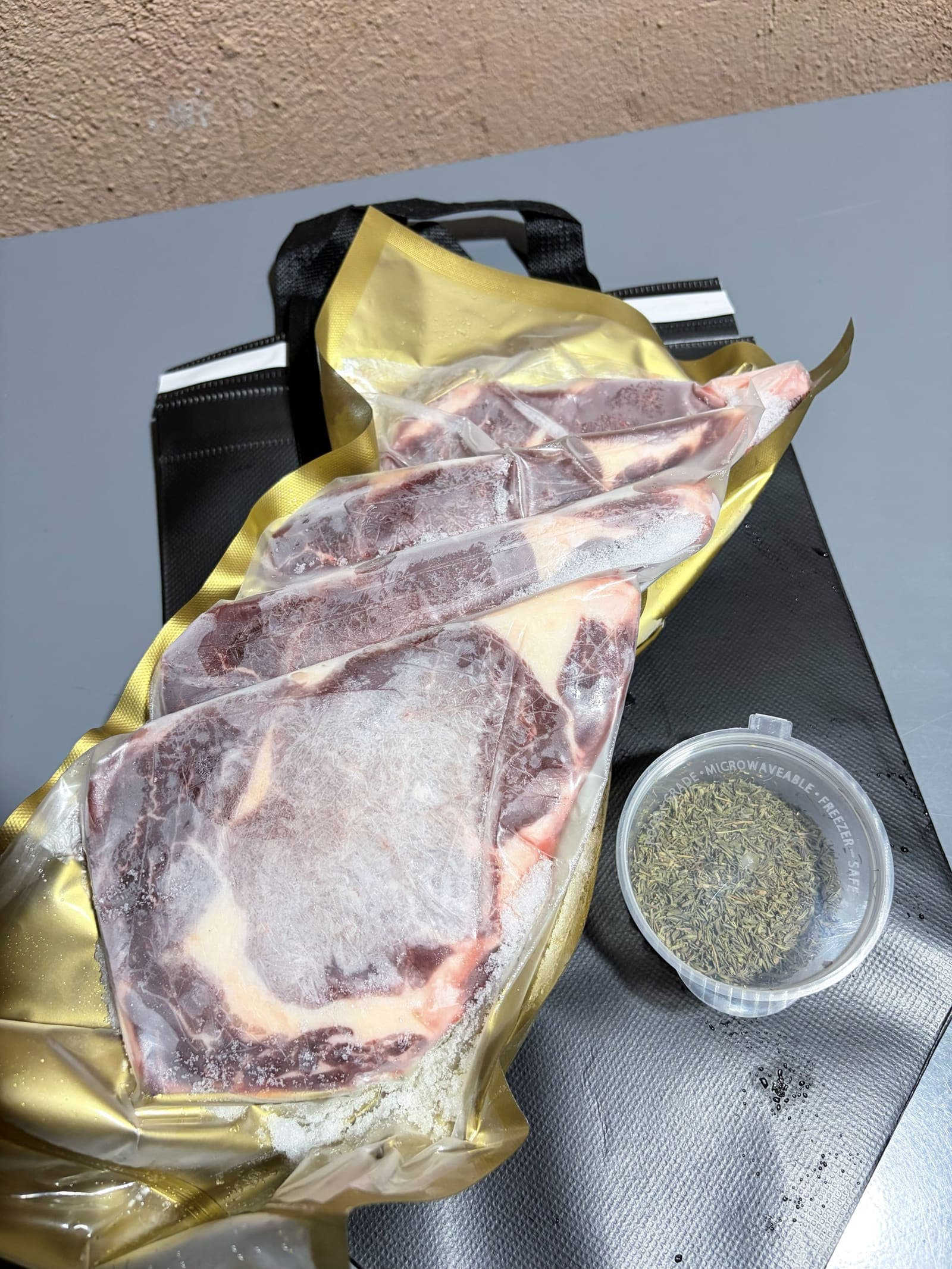 Thick-cut butter-aged steaks, vacuum sealed and frozen solid in the Daily Steak PH gold pack