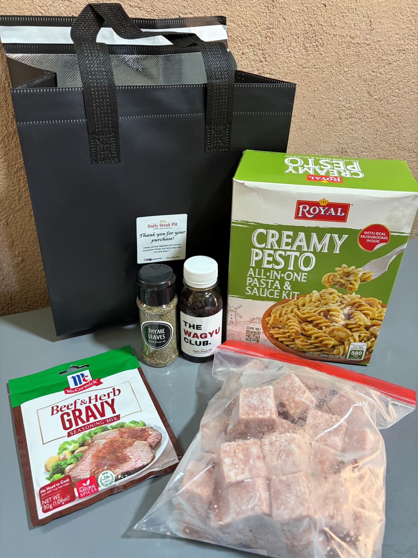 Daily Steak PH add-ons: the homemade Wagyu Club sauce, a creamy pesto pasta kit, gravy mix, thyme leaves and wagyu cubes